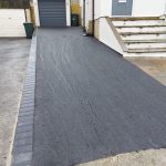 Tarmac driveway with a charcoal coloured block paved border
